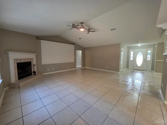 a view of an empty room with a fireplace