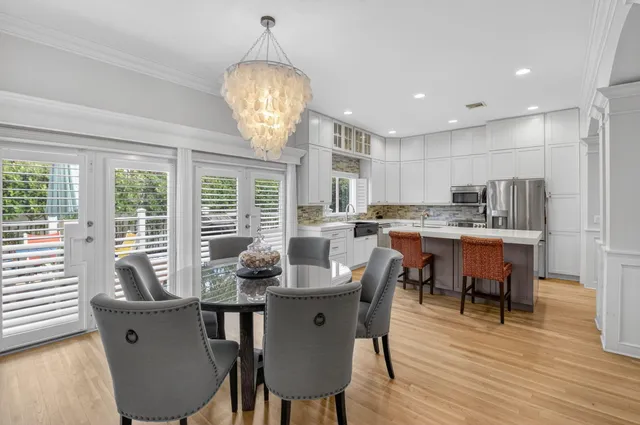 a view of a dining room with furniture window and wooden floor