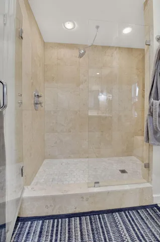 a bathroom with a bathtub and a shower