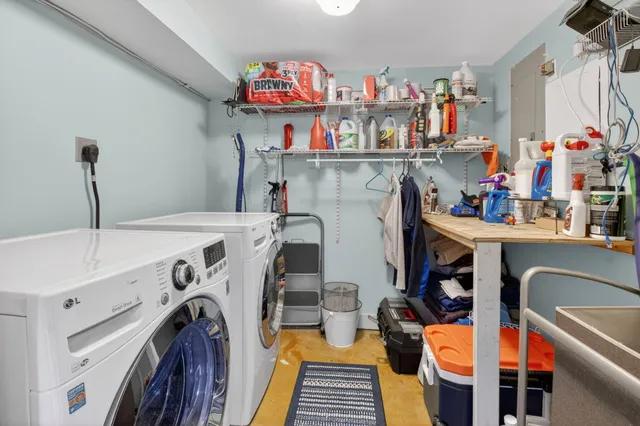 a view of storage and utility room with washer and dryer