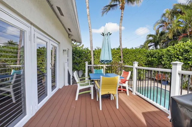 a view of a balcony with furniture