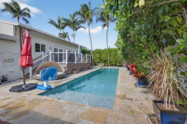 a view of a backyard with sitting area