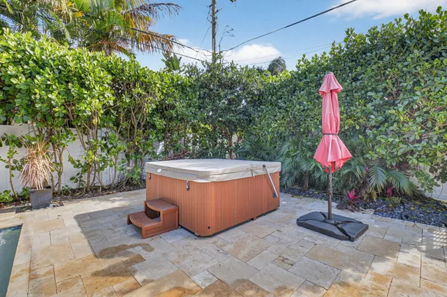 a view of a porch with potted plants