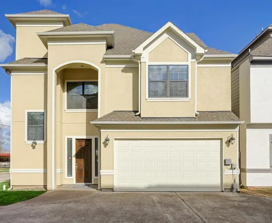 a front view of a house with a garage