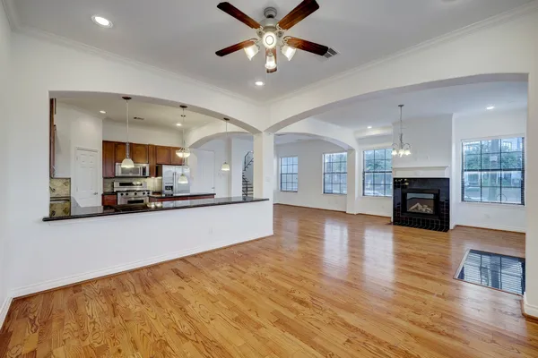 a view of a kitchen with a sink and a fireplace