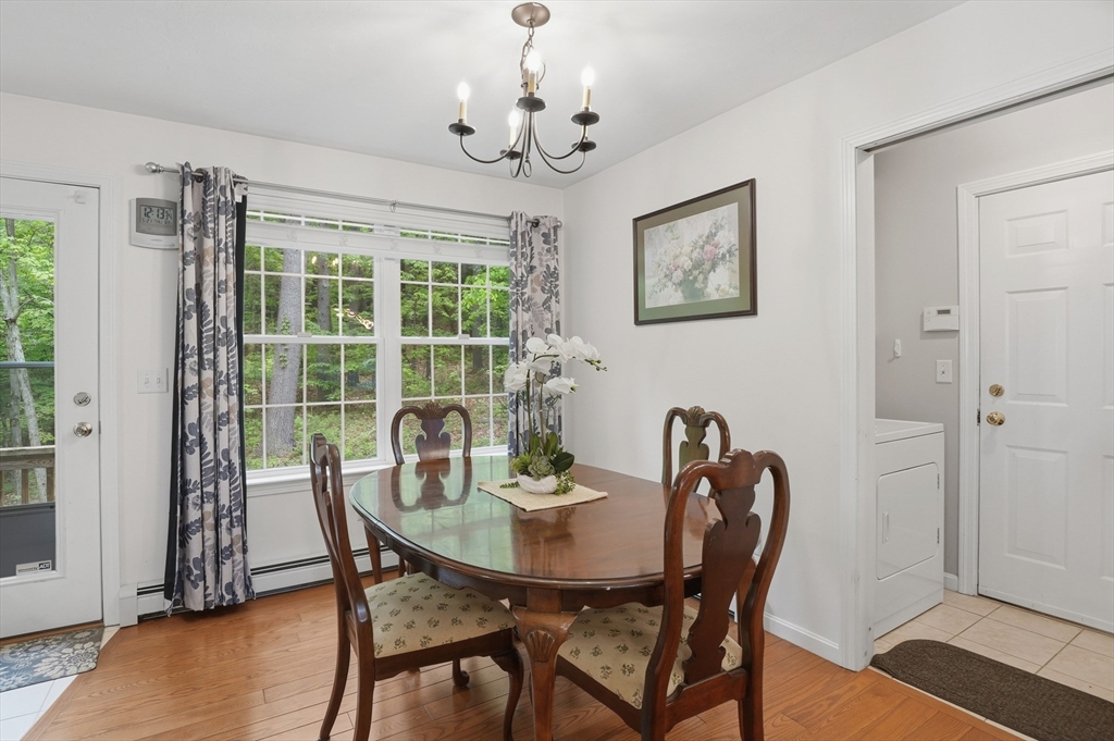 186 Common Street Groton, MA 01450 - Photo 12 of 28 a view of a dining room with furniture window and outside view