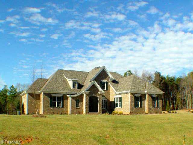 7017 Denison Road Summerfield, NC 27358 - Photo 1 of 9 Exterior Front. View of brick & stone facade