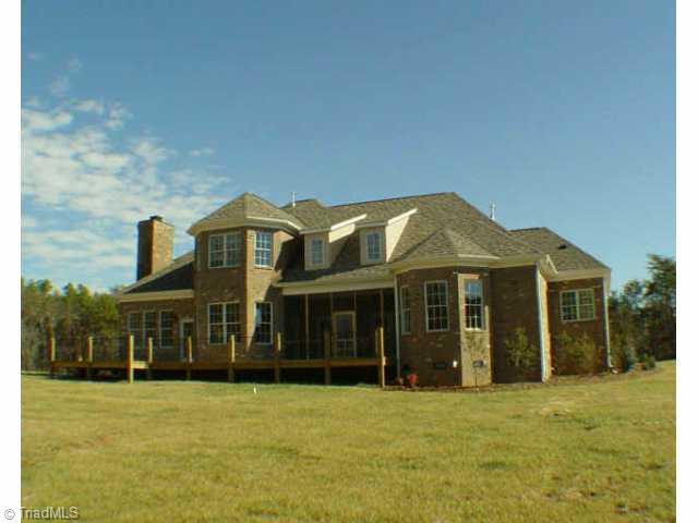 7017 Denison Road Summerfield, NC 27358 - Photo 2 of 9 Other. Back view showing large deck and screened porch.