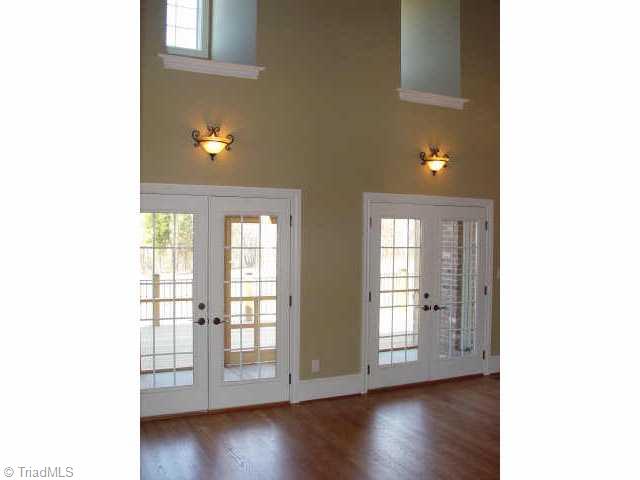 7017 Denison Road Summerfield, NC 27358 - Photo 6 of 9 Other. Dramatic two story living room with handsome hardwood floors.