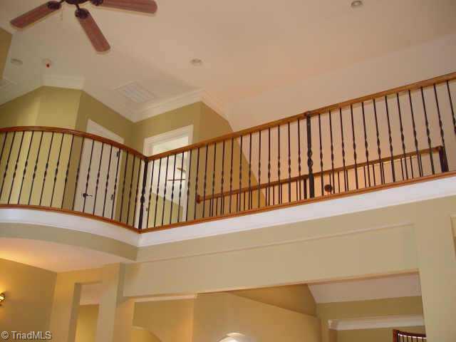 7017 Denison Road Summerfield, NC 27358 - Photo 9 of 9 Other. Wrought iron railing on balcony overlooking the dramatic two story living room.