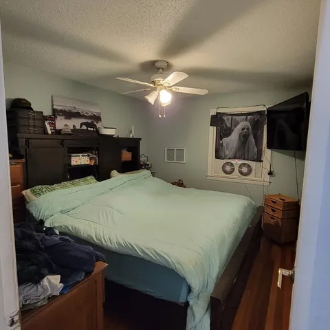 a bedroom with a bed and a closet