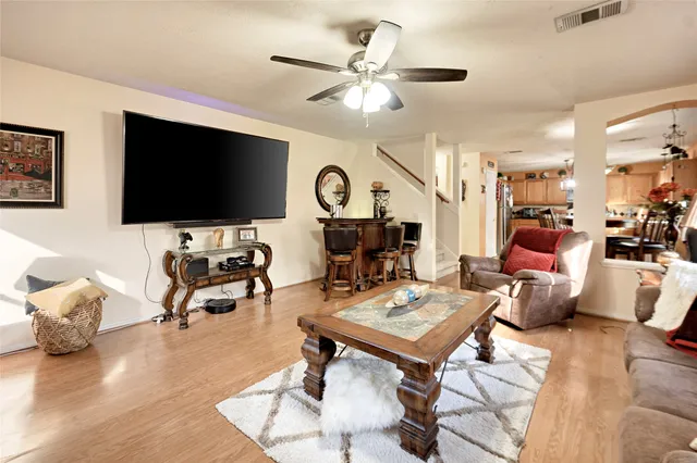 a living room with furniture and a flat screen tv