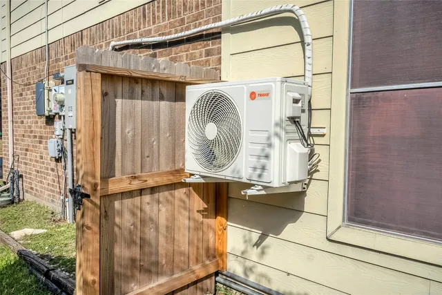 a room with water heater and windows