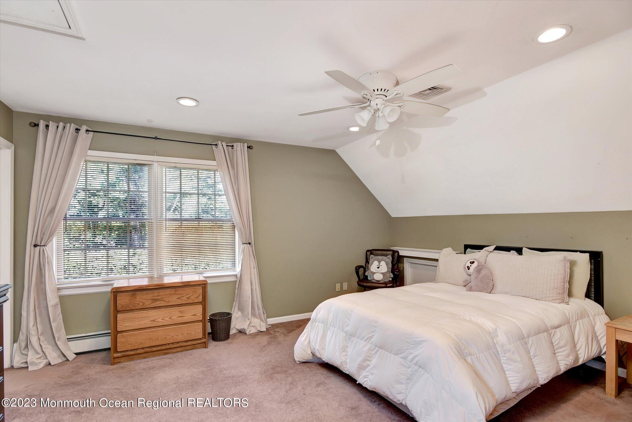 535 Brickyard Road Freehold, NJ 07728 - Photo 12 of 52 a bedroom with a bed and a large window