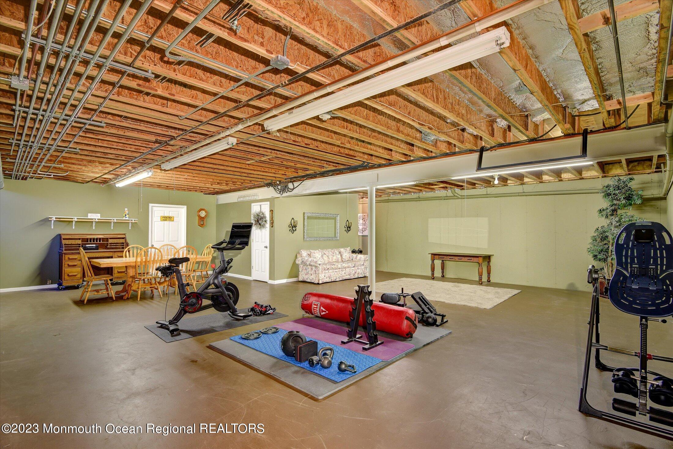 535 Brickyard Road Freehold, NJ 07728 - Photo 20 of 52 a living room with furniture and a car parked in it