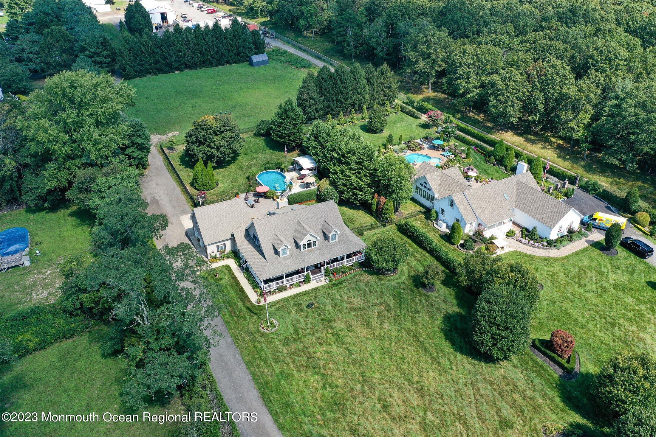 535 Brickyard Road Freehold, NJ 07728 - Photo 32 of 52 an aerial view of a house with pool outdoor seating and yard