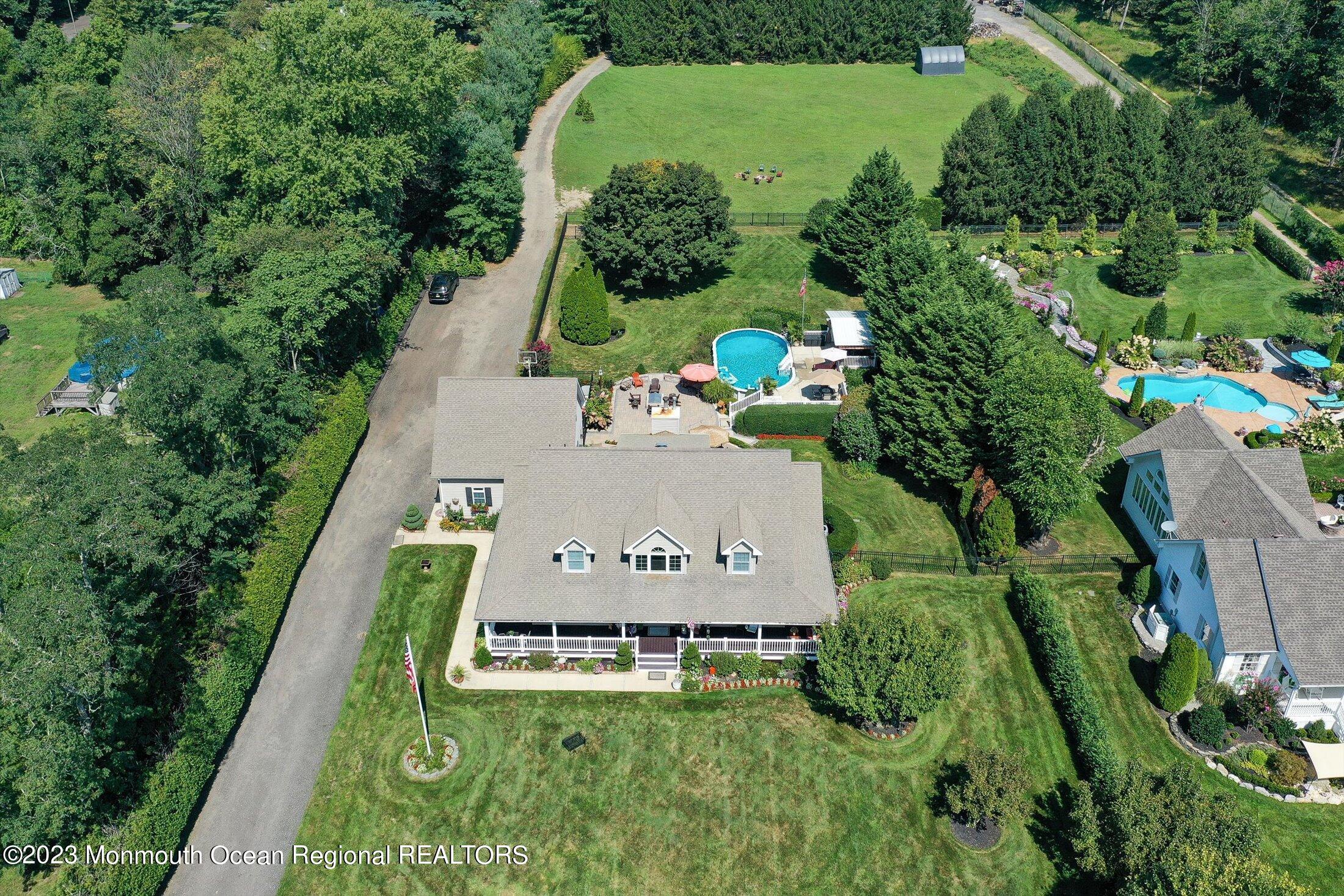 535 Brickyard Road Freehold, NJ 07728 - Photo 34 of 52 an aerial view of a residential houses with outdoor space and street view