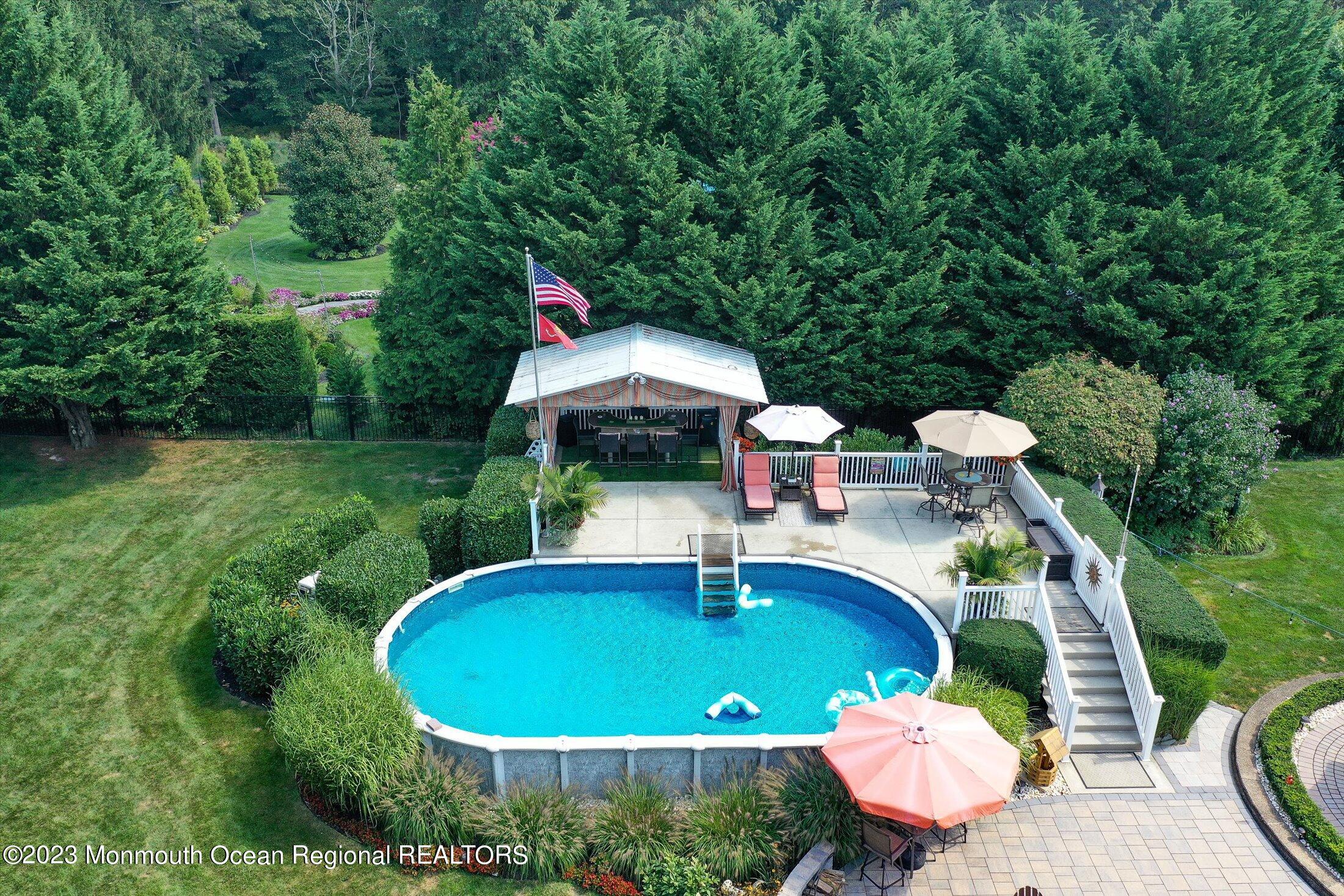 535 Brickyard Road Freehold, NJ 07728 - Photo 42 of 52 a view of a table and chairs in patio