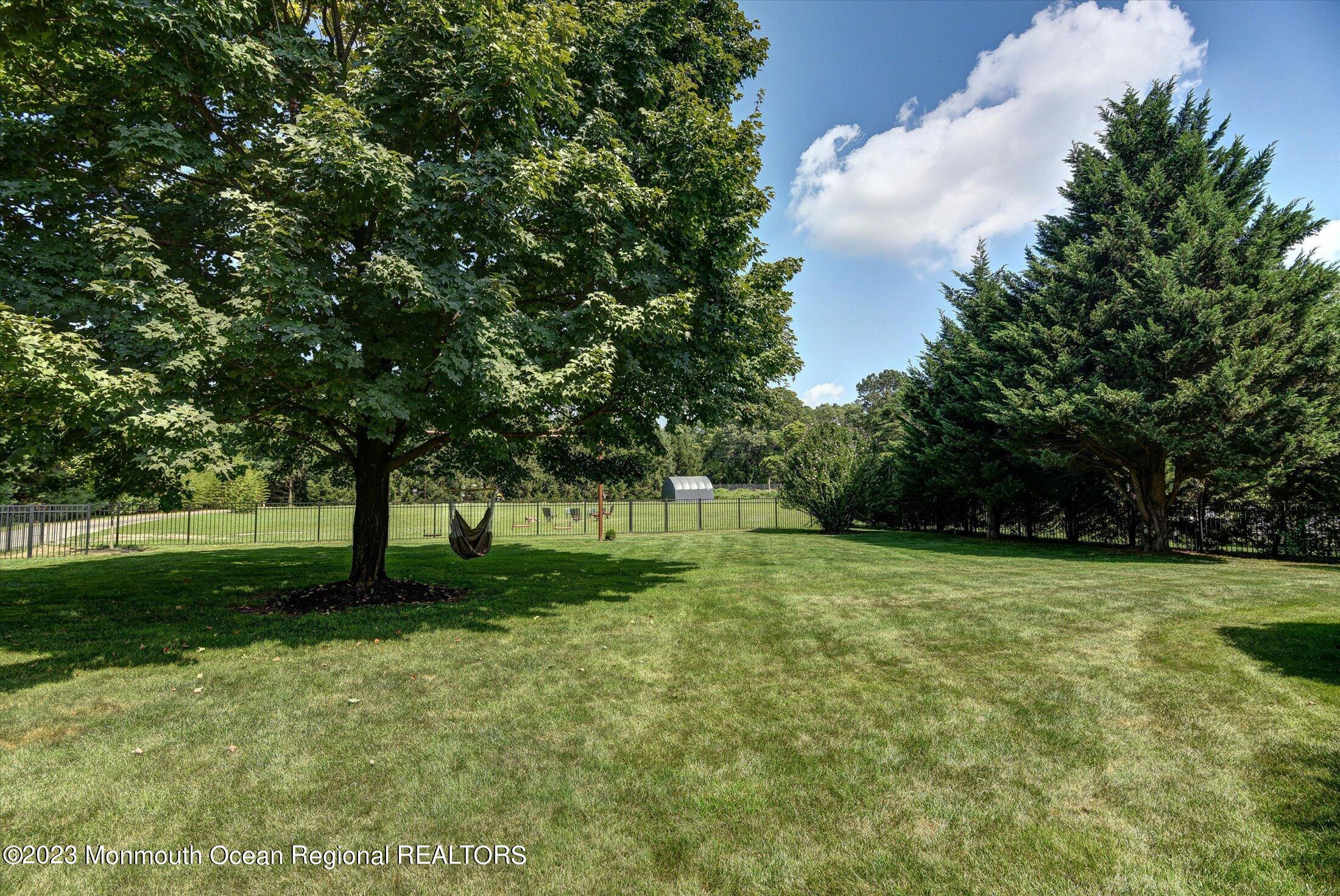 535 Brickyard Road Freehold, NJ 07728 - Photo 48 of 52 a view of a grassy field with trees