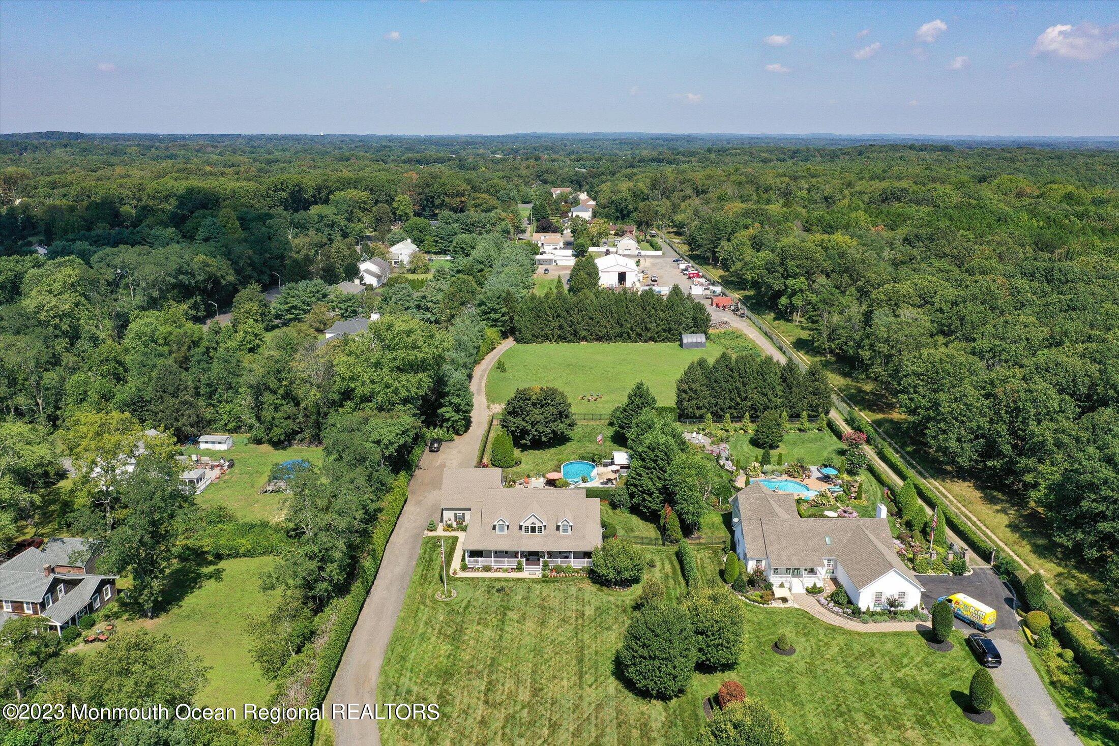 535 Brickyard Road Freehold, NJ 07728 - Photo 50 of 52 an aerial view of a houses with a yard