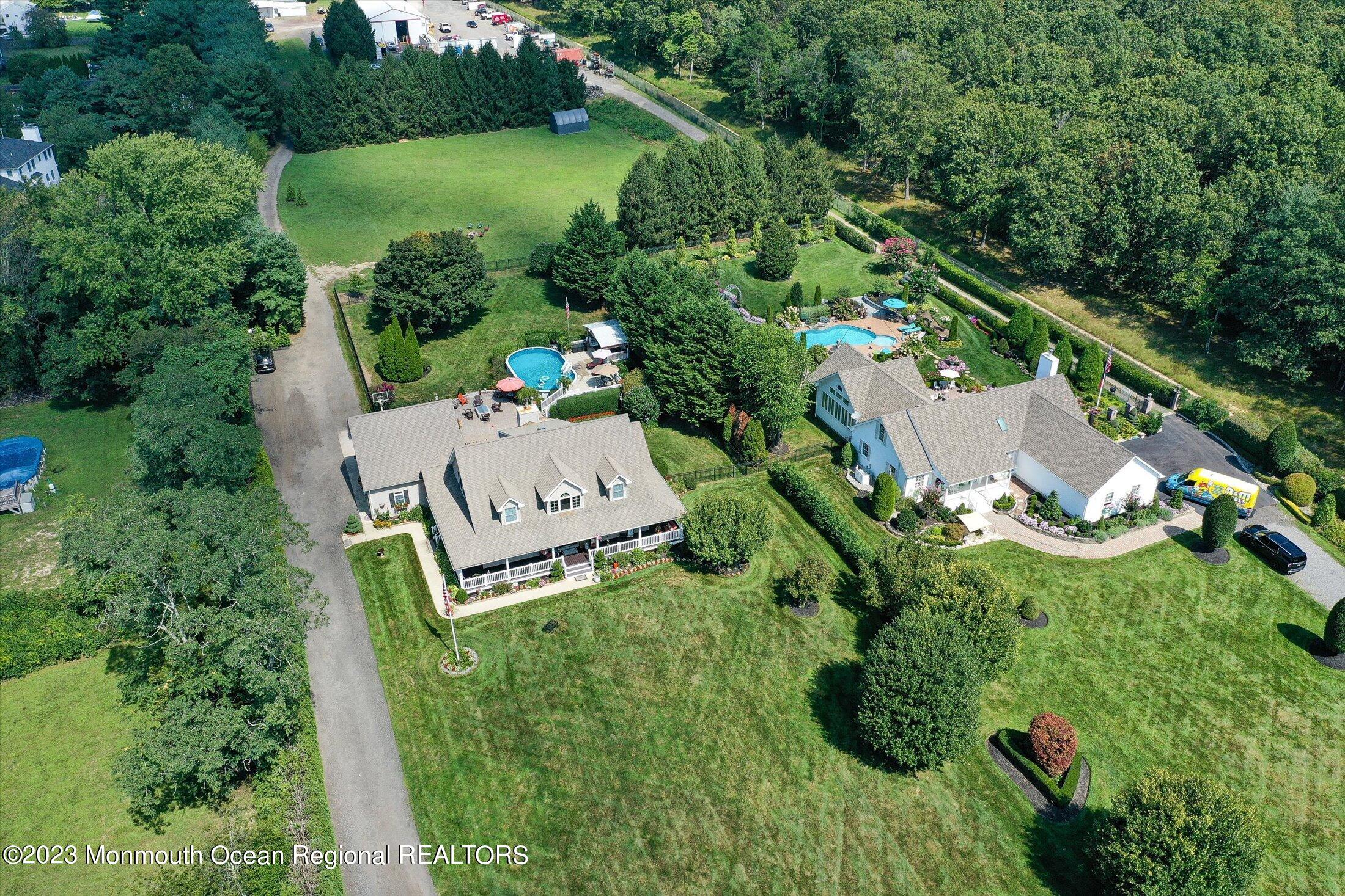 535 Brickyard Road Freehold, NJ 07728 - Photo 51 of 52 an aerial view of residential house with outdoor space and trees all around