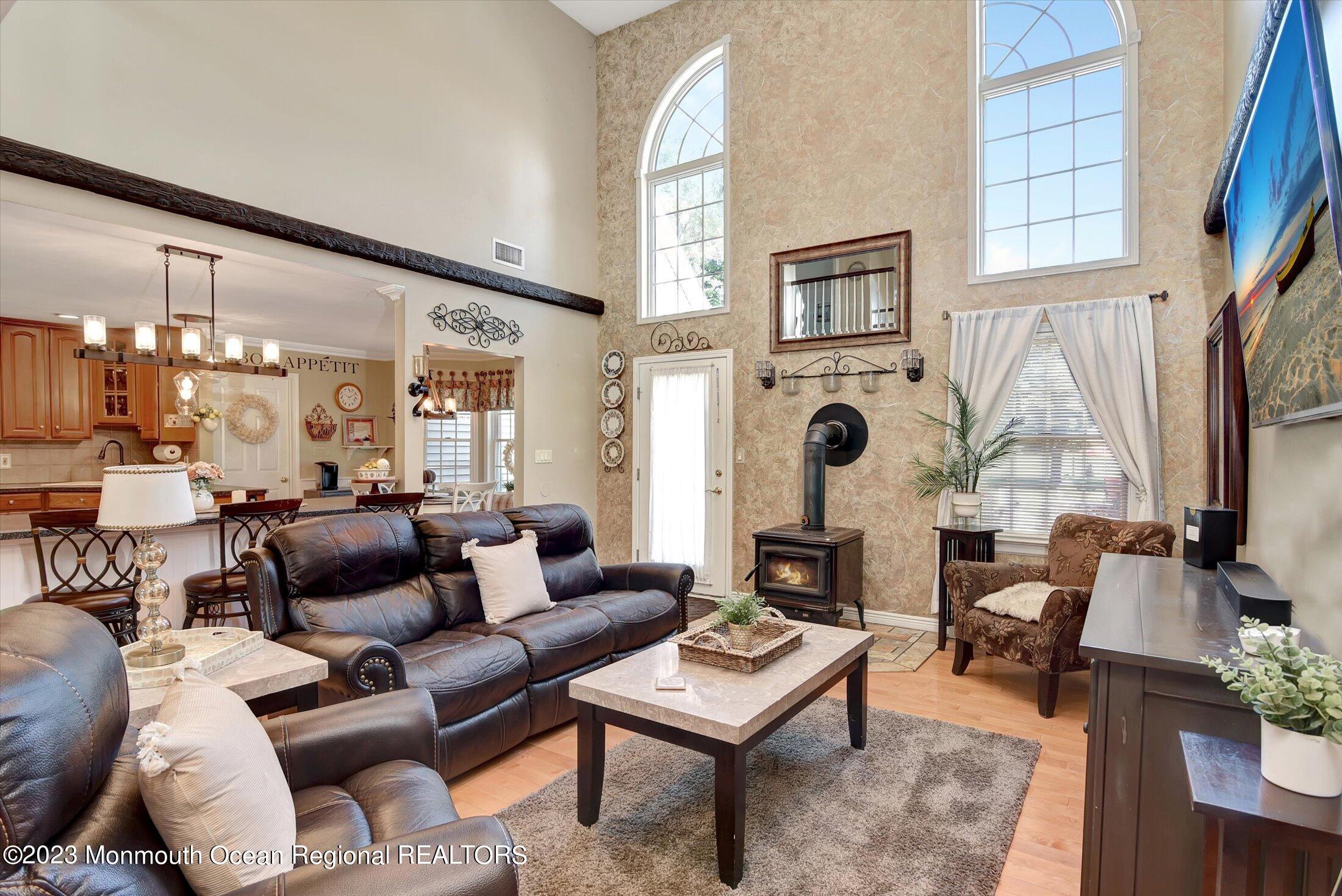 535 Brickyard Road Freehold, NJ 07728 - Photo 7 of 52 a living room with furniture fireplace and a large window