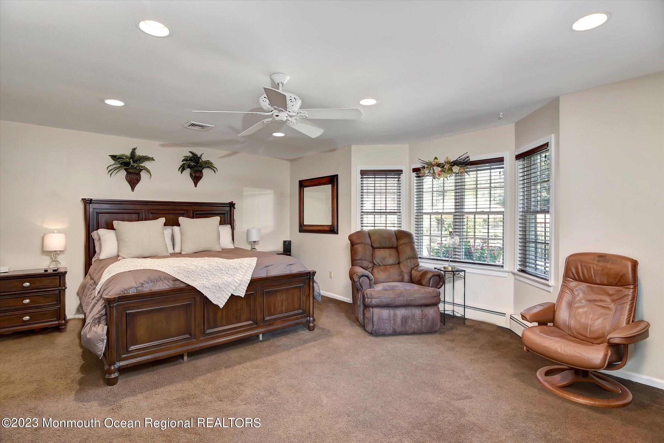 535 Brickyard Road Freehold, NJ 07728 - Photo 10 of 52 a bedroom with a bed and a couch