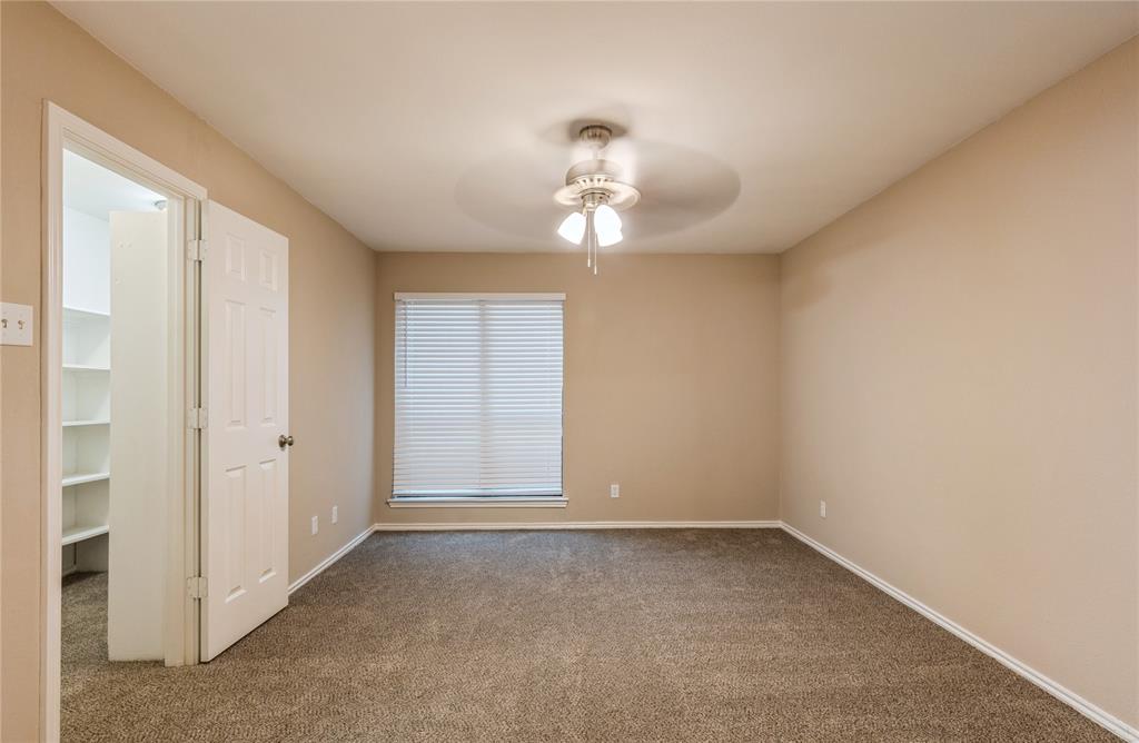 5750 Phoenix Drive, Unit 27 Dallas, TX 75231 - Photo 12 of 19 wooden floor in an empty room with a window