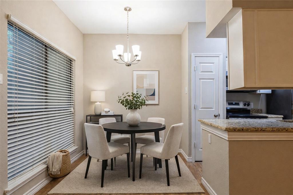 5750 Phoenix Drive, Unit 27 Dallas, TX 75231 - Photo 2 of 19 a view of a dining room with furniture and chandelier
