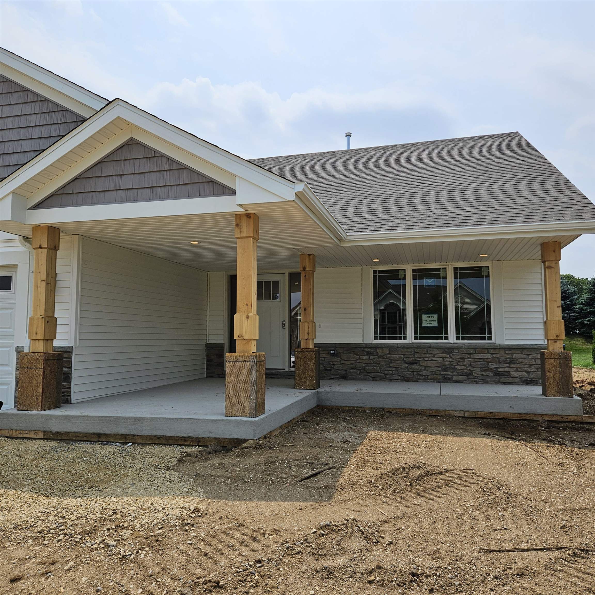 5552 Waters Bend Drive Belvidere, IL 61008 - Photo 11 of 12 a front view of a house with a yard