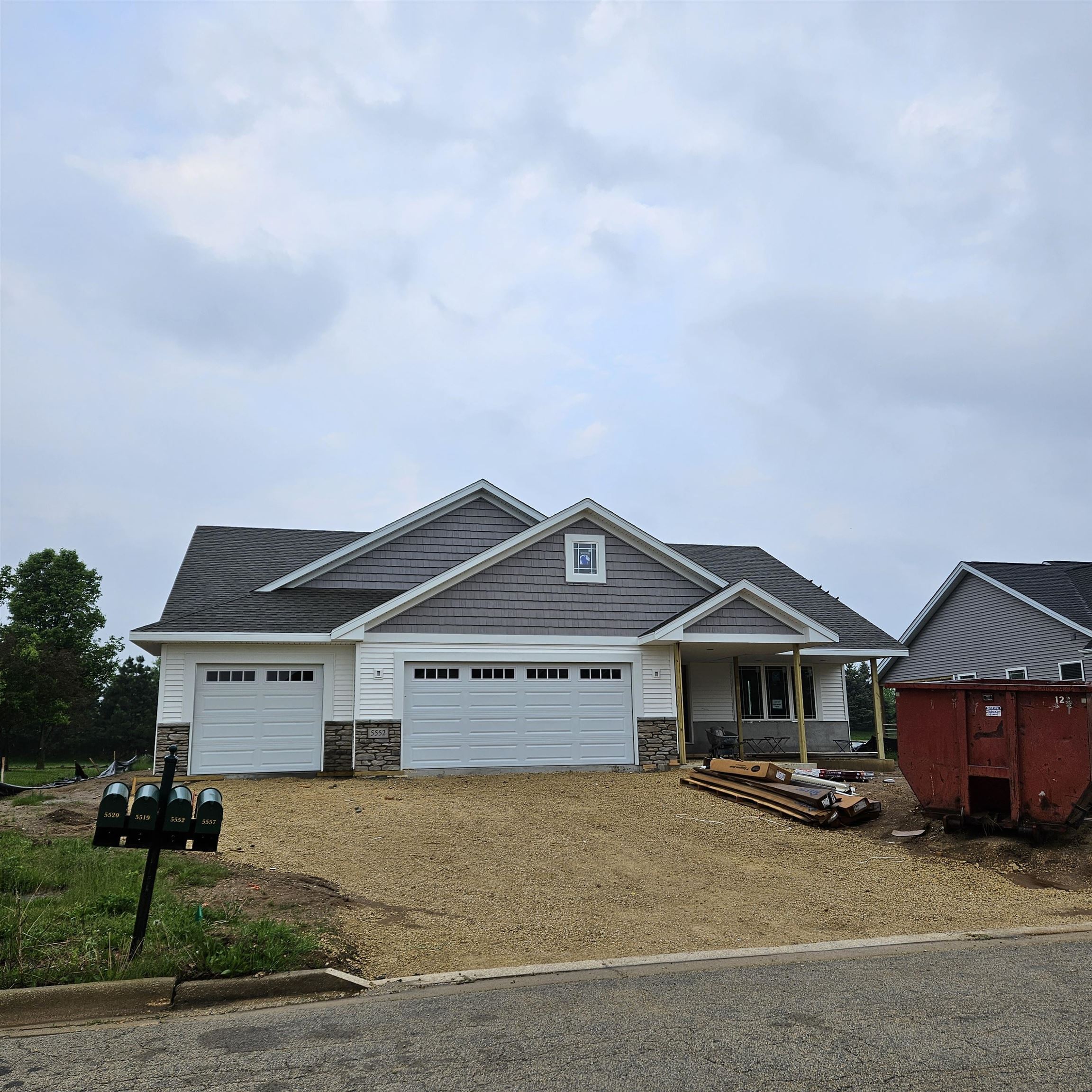 5552 Waters Bend Drive Belvidere, IL 61008 - Photo 12 of 12 a front view of a house with a yard and garage