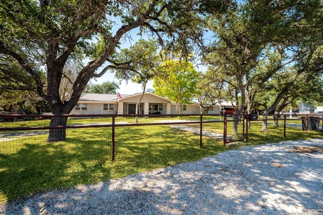 a view of swimming pool with tree s