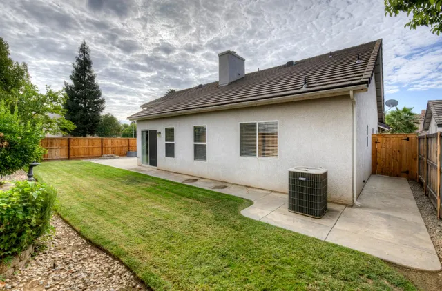a backyard of a house with seating space