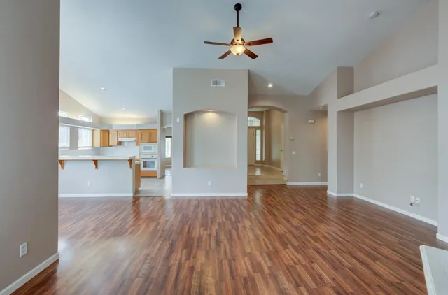 a view of a kitchen with wooden floor and a kitchen