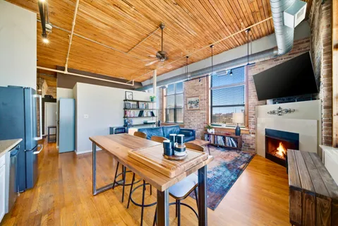 a view of a livingroom with furniture and a fireplace