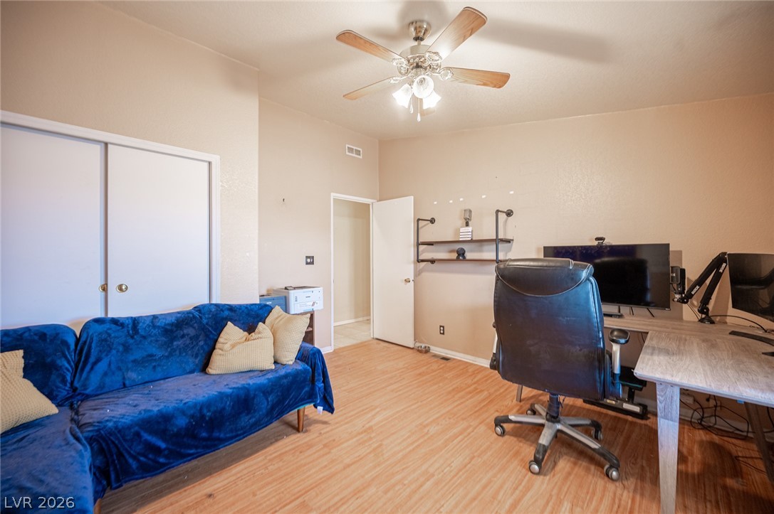 3200 Maple Road Pahrump, NV 89048 - Photo 25 of 53 Functional home office or flexible living space features durable wood flooring.