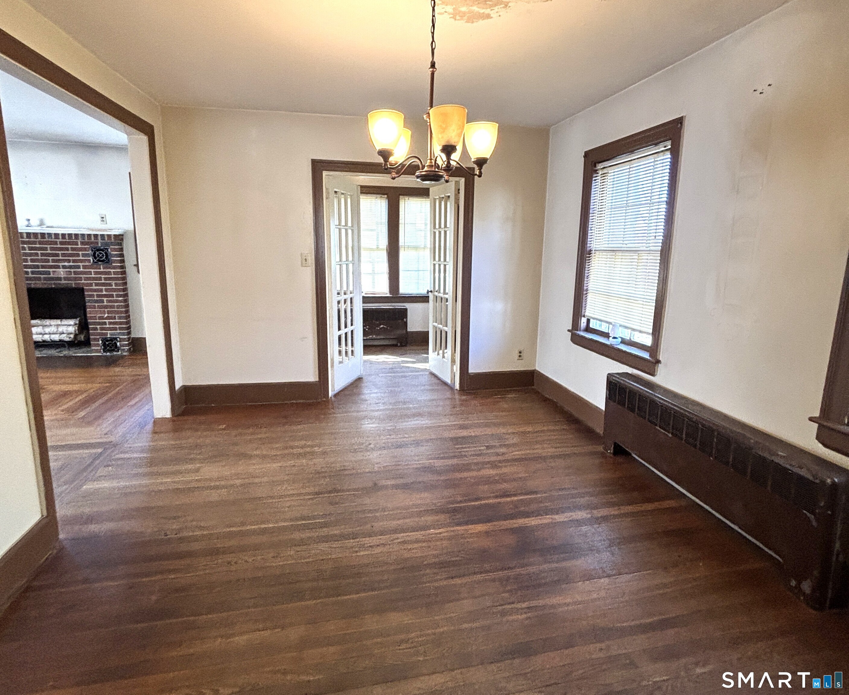 136 Broadway Street Colchester, CT 06415 - Photo 15 of 35 a view of an empty room with wooden floor and a window