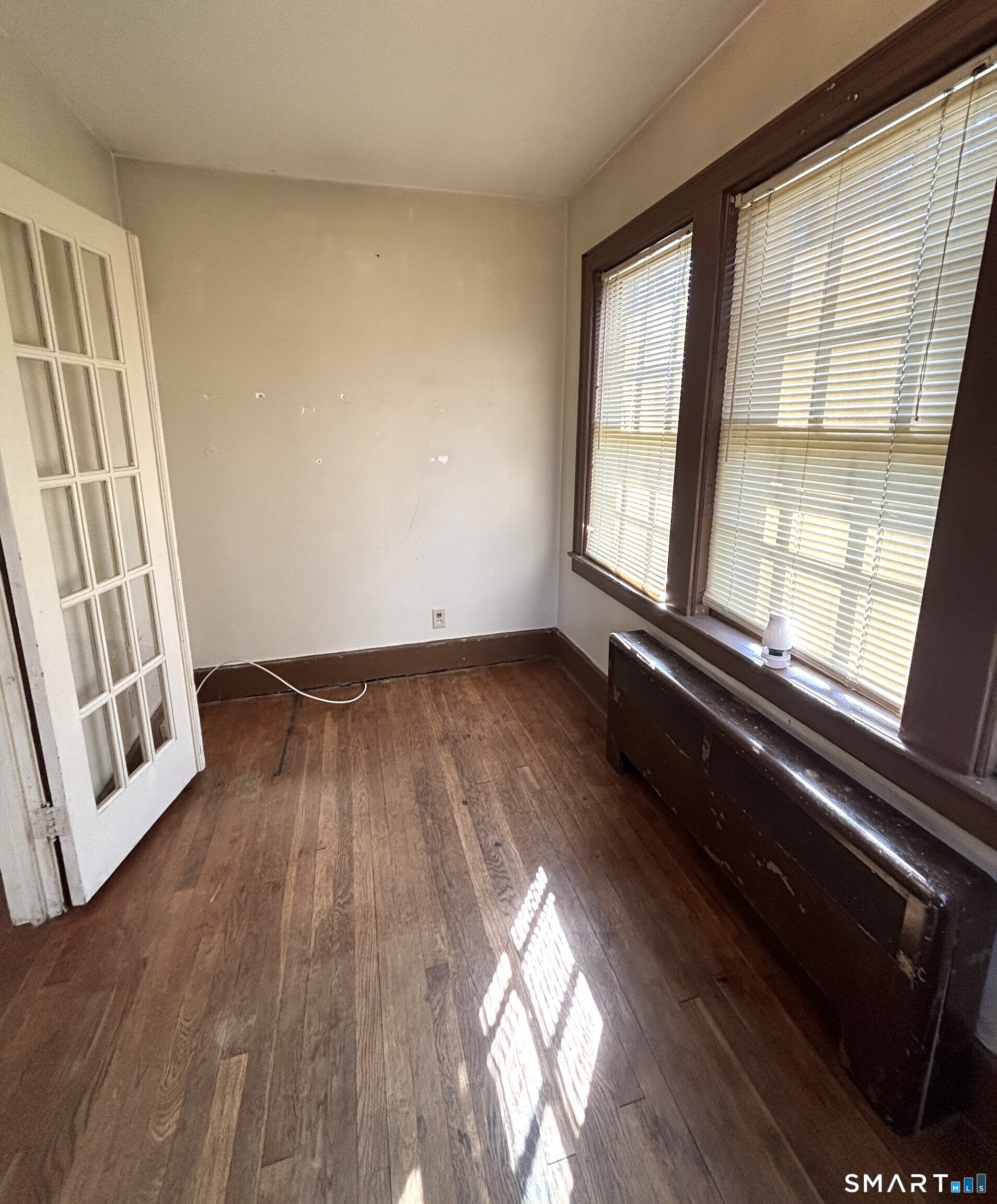 136 Broadway Street Colchester, CT 06415 - Photo 17 of 35 wooden floor in an empty room with a window