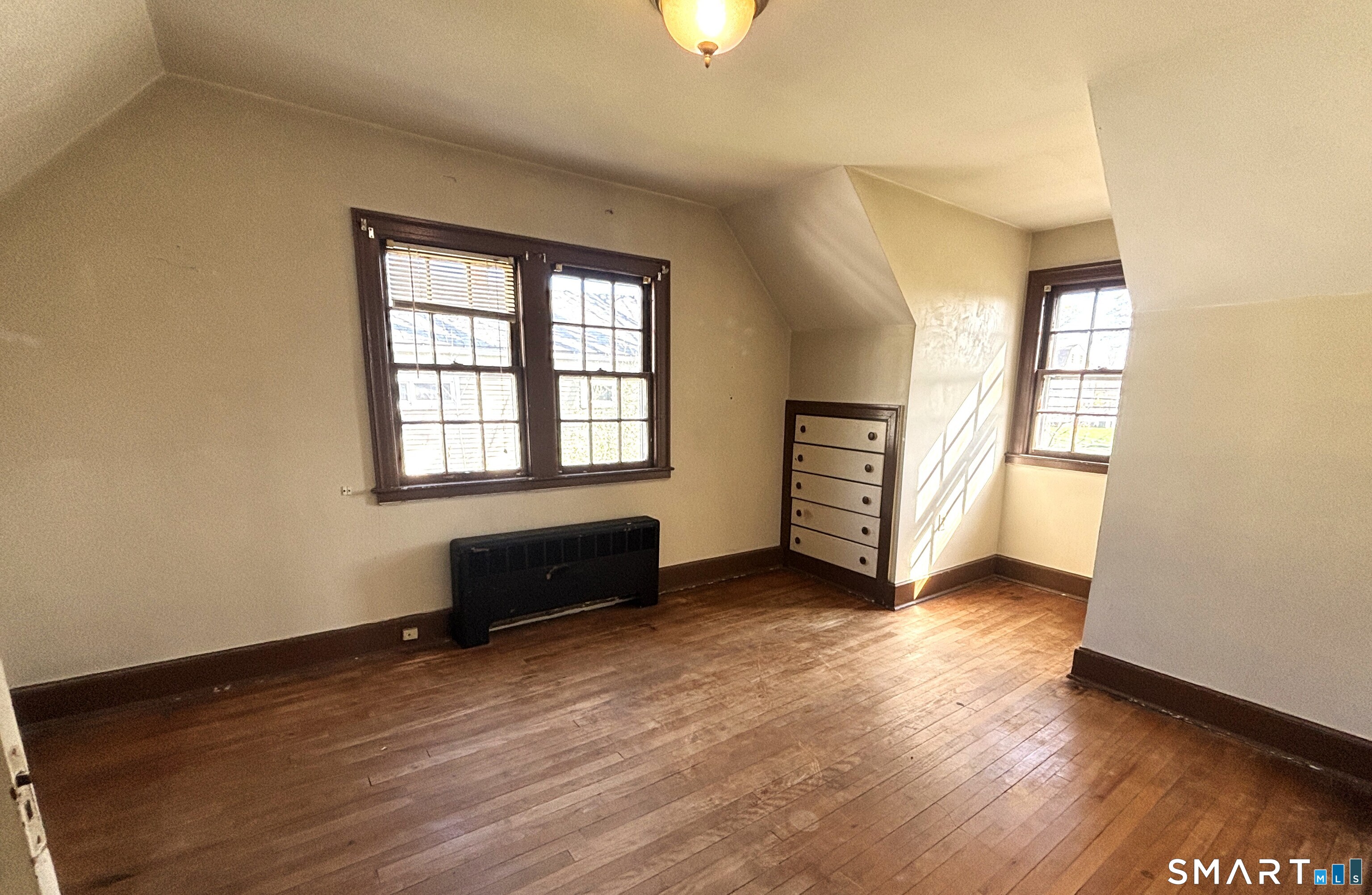 136 Broadway Street Colchester, CT 06415 - Photo 20 of 35 an empty room with wooden floor and windows