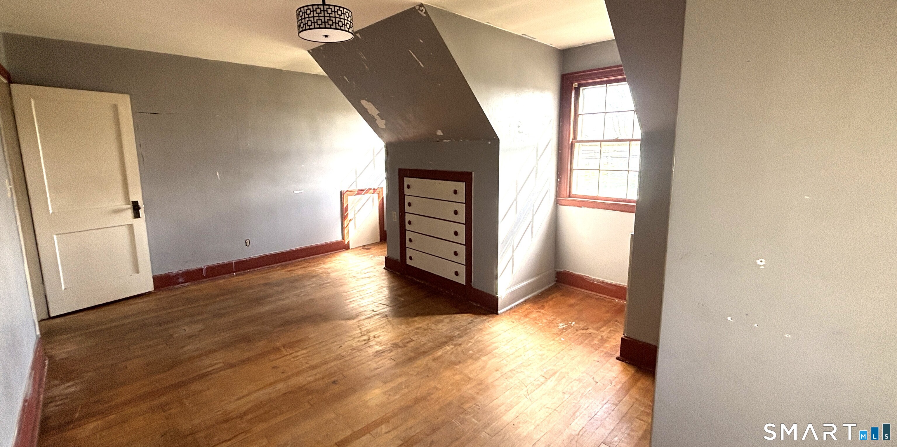 136 Broadway Street Colchester, CT 06415 - Photo 24 of 35 wooden floor in an empty room with a window