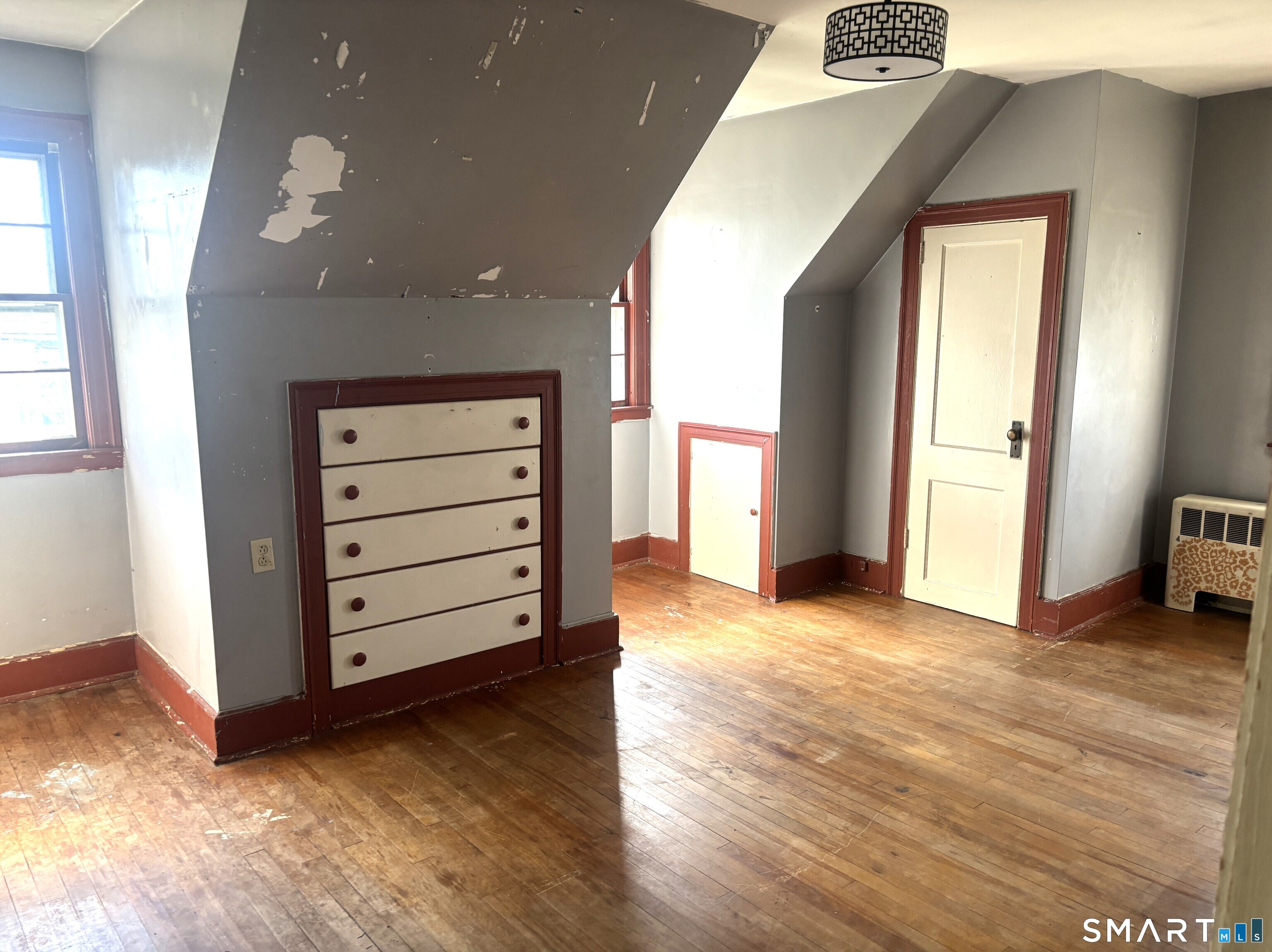 136 Broadway Street Colchester, CT 06415 - Photo 25 of 35 a view of a room with cabinet and stairs