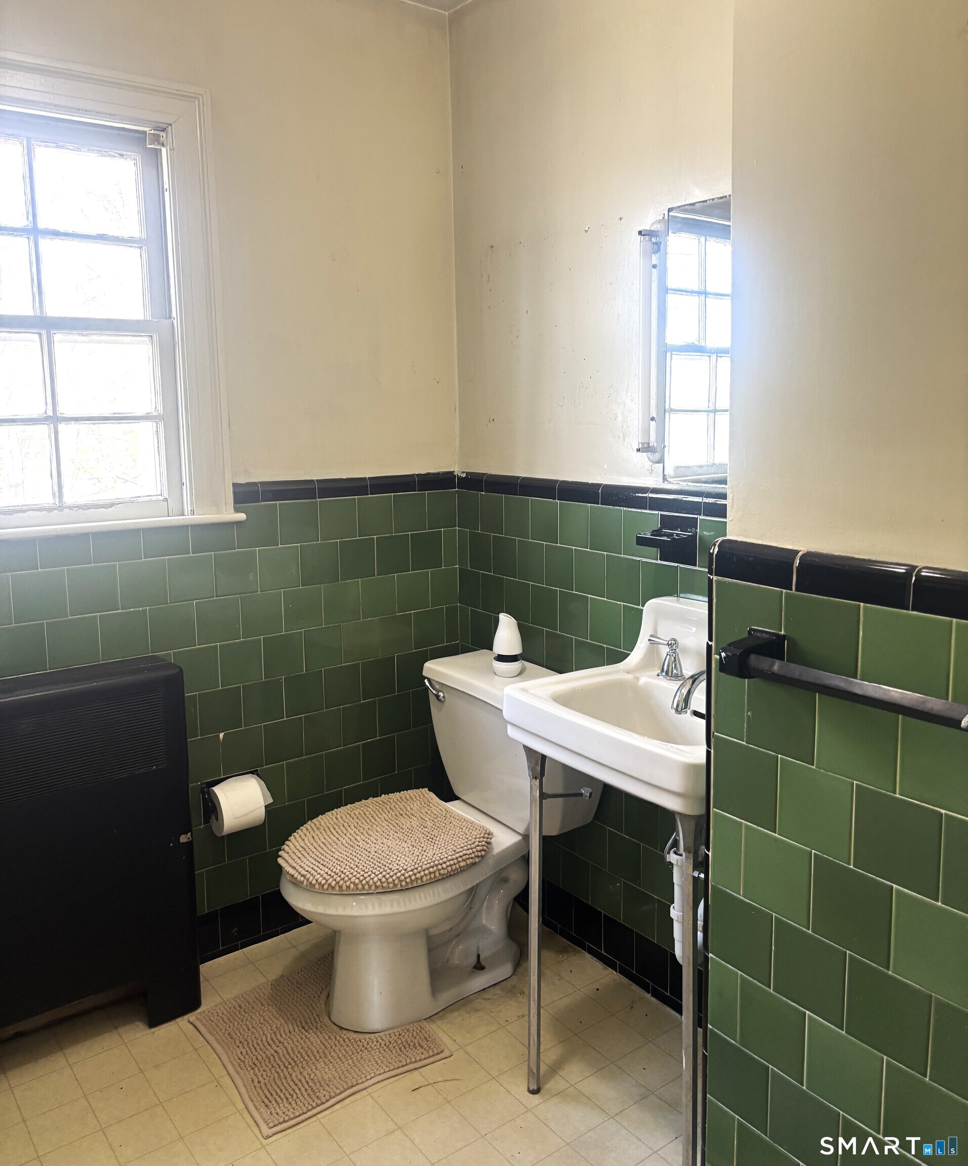 136 Broadway Street Colchester, CT 06415 - Photo 28 of 35 a bathroom with a toilet a sink and a window