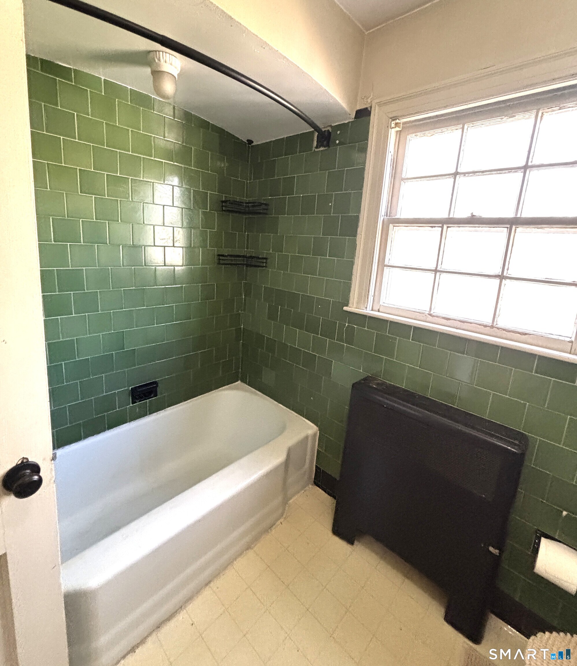136 Broadway Street Colchester, CT 06415 - Photo 29 of 35 a bathroom with a bathtub and a shower