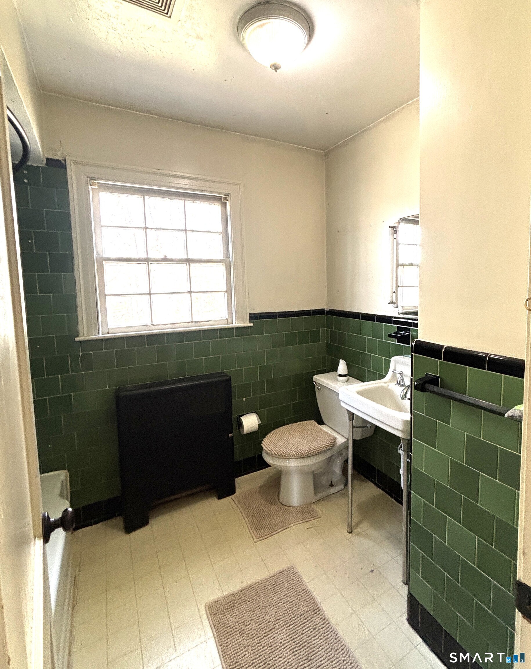 136 Broadway Street Colchester, CT 06415 - Photo 30 of 35 a bathroom with a toilet and a sink