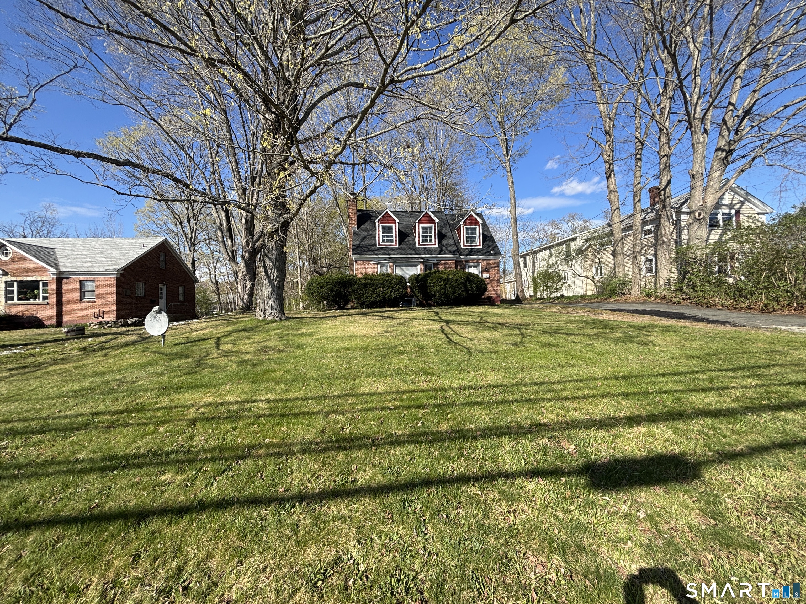 136 Broadway Street Colchester, CT 06415 - Photo 34 of 35 a view of a big room with a big yard and large trees