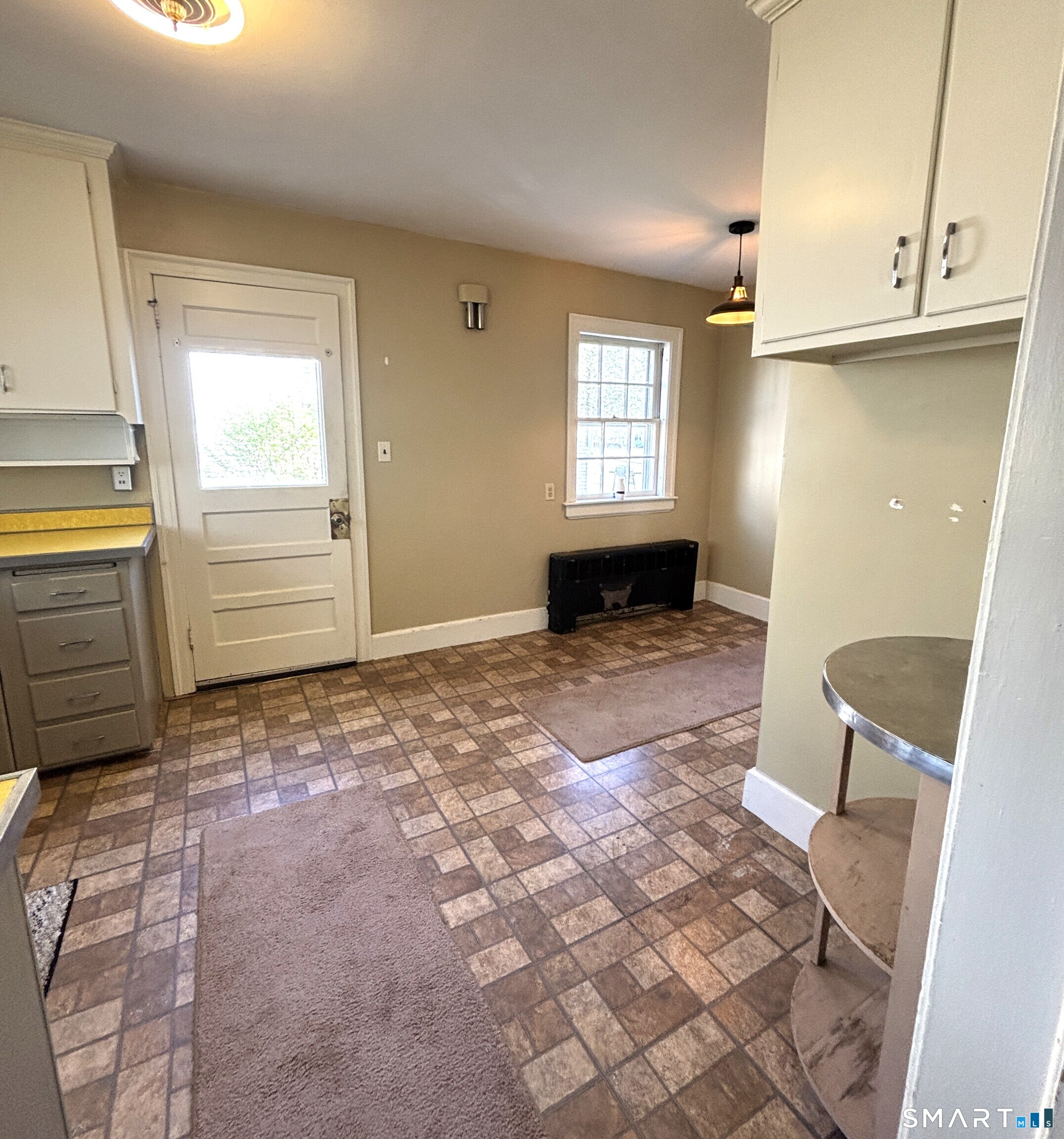 136 Broadway Street Colchester, CT 06415 - Photo 5 of 35 a view of an empty room with a window