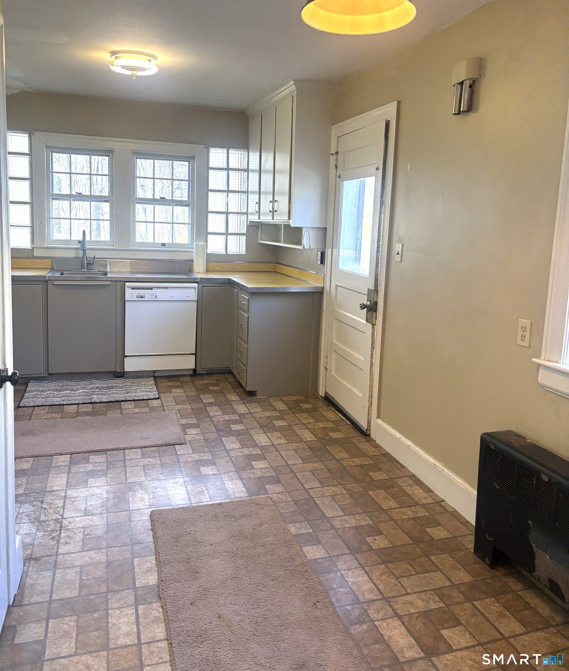 136 Broadway Street Colchester, CT 06415 - Photo 6 of 35 a kitchen with a stove a sink and a refrigerator
