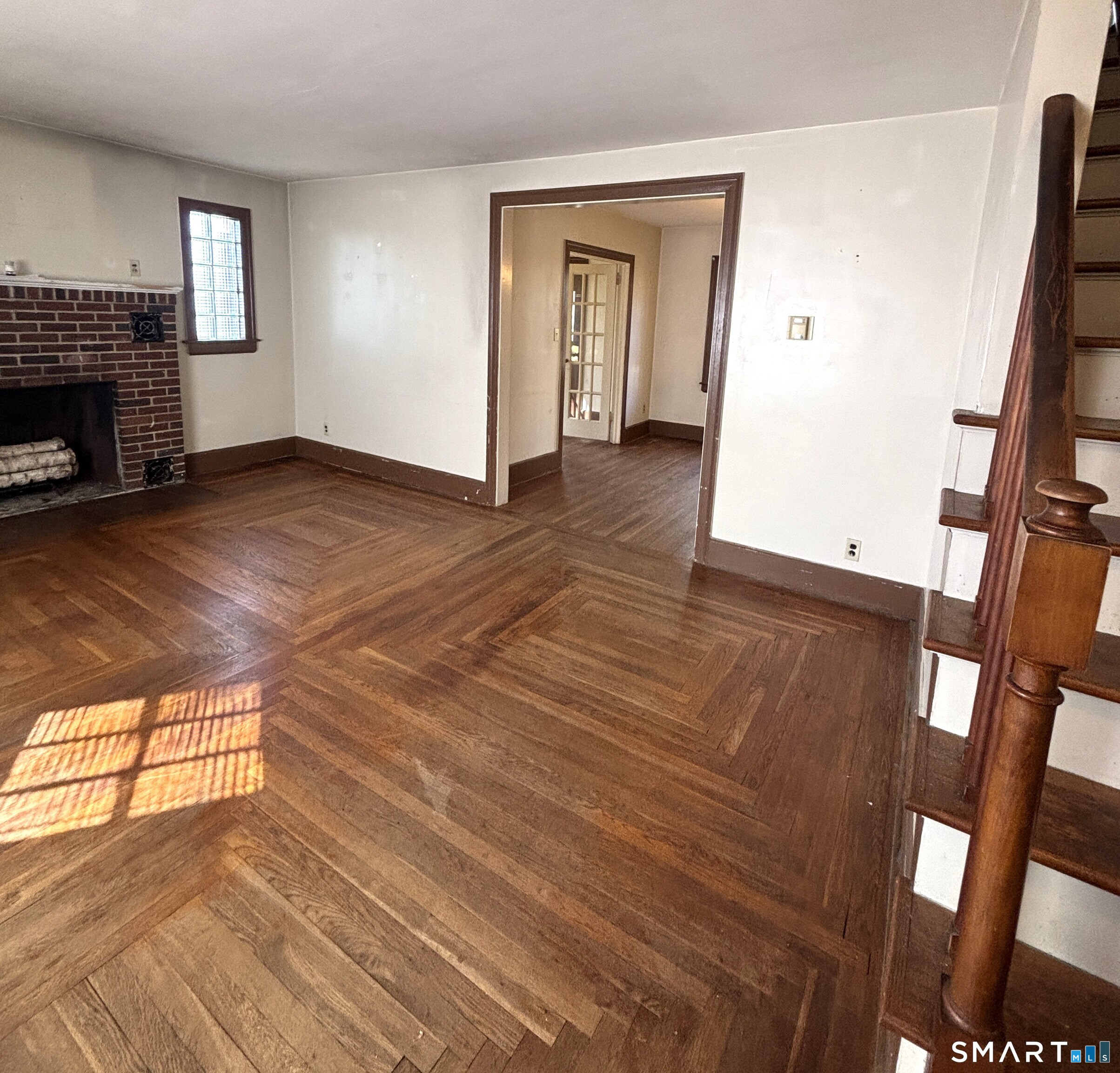 136 Broadway Street Colchester, CT 06415 - Photo 10 of 35 a view of empty room with wooden floor and fan