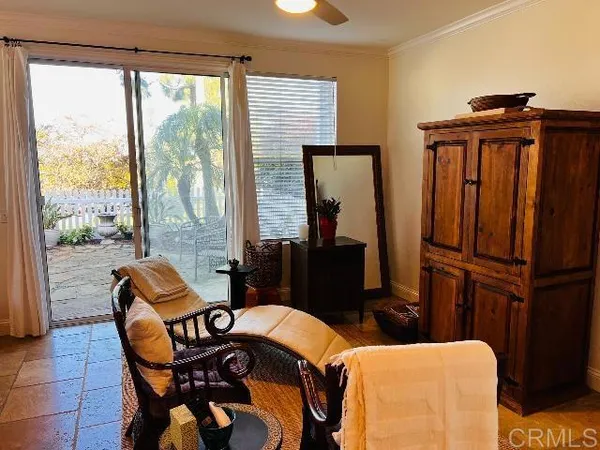 a utility room with stainless steel appliances granite countertop a refrigerator a washer and dryer