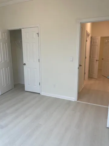 a view of an empty room with a fireplace